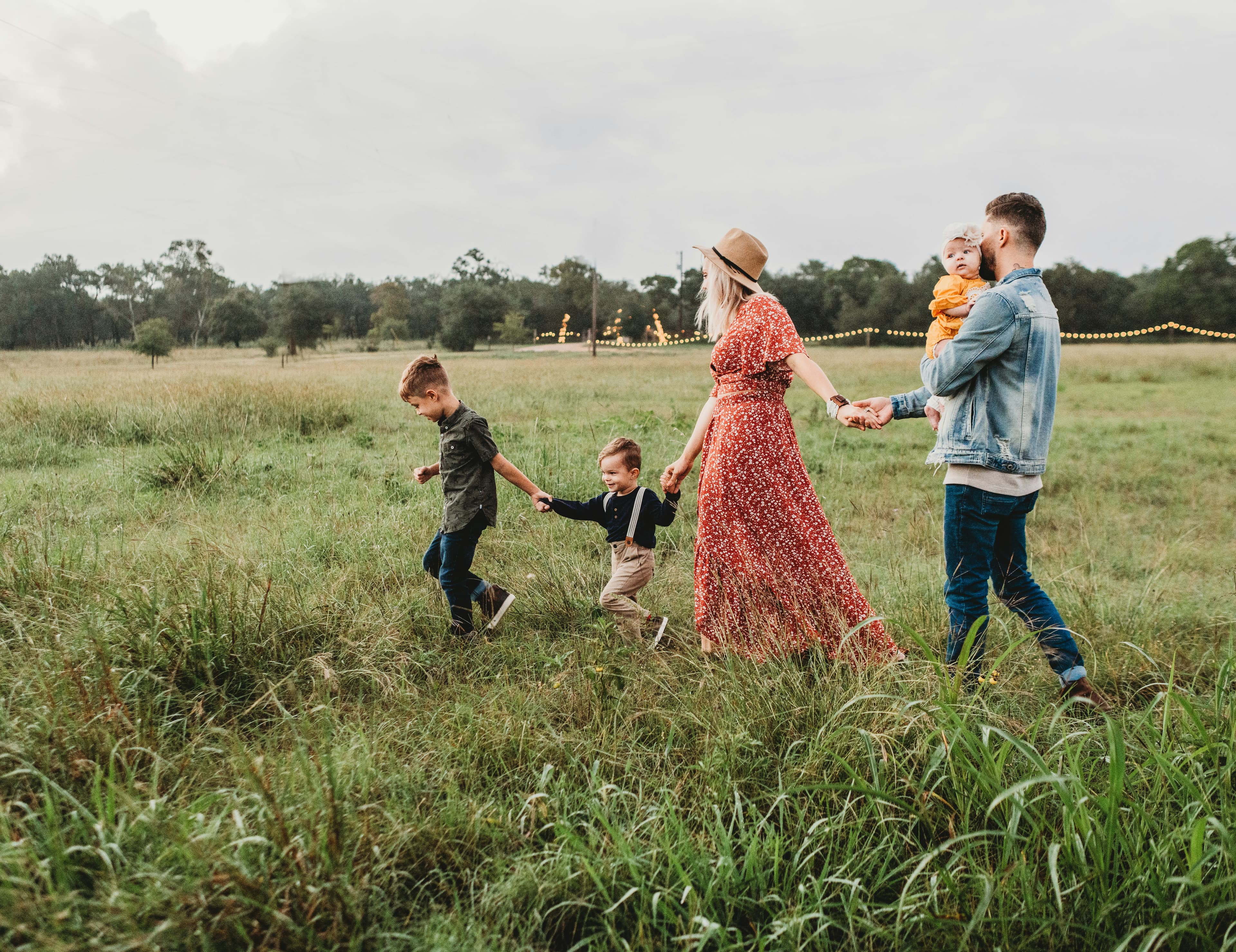 Family walking together through a field